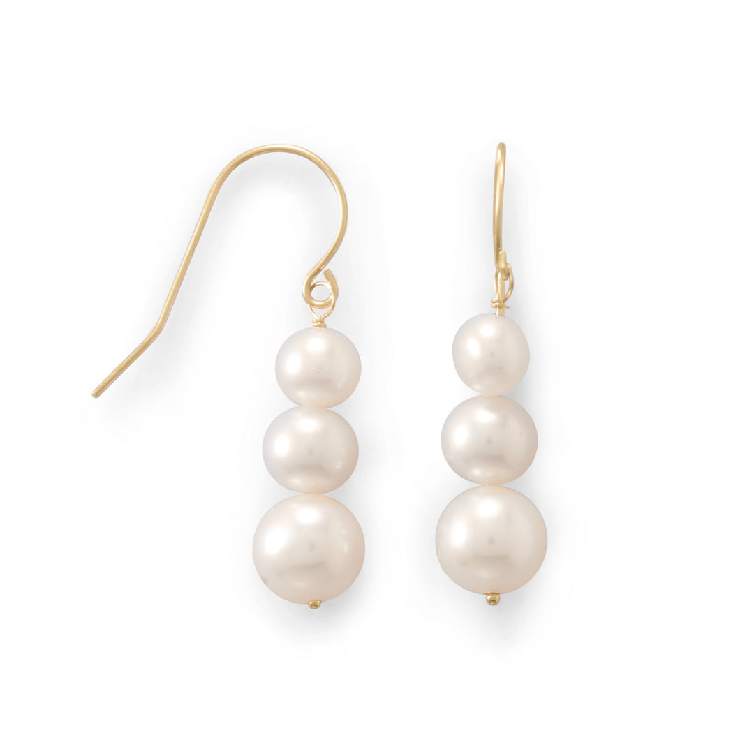 Perfectly pretty. 14kt gold french wire earrings with three stacked cultured freshwater pearls. Pearls measure approximately 5mm, 6mm and 7mm. Full hanging length is approximately 30mm. 14kt Gold