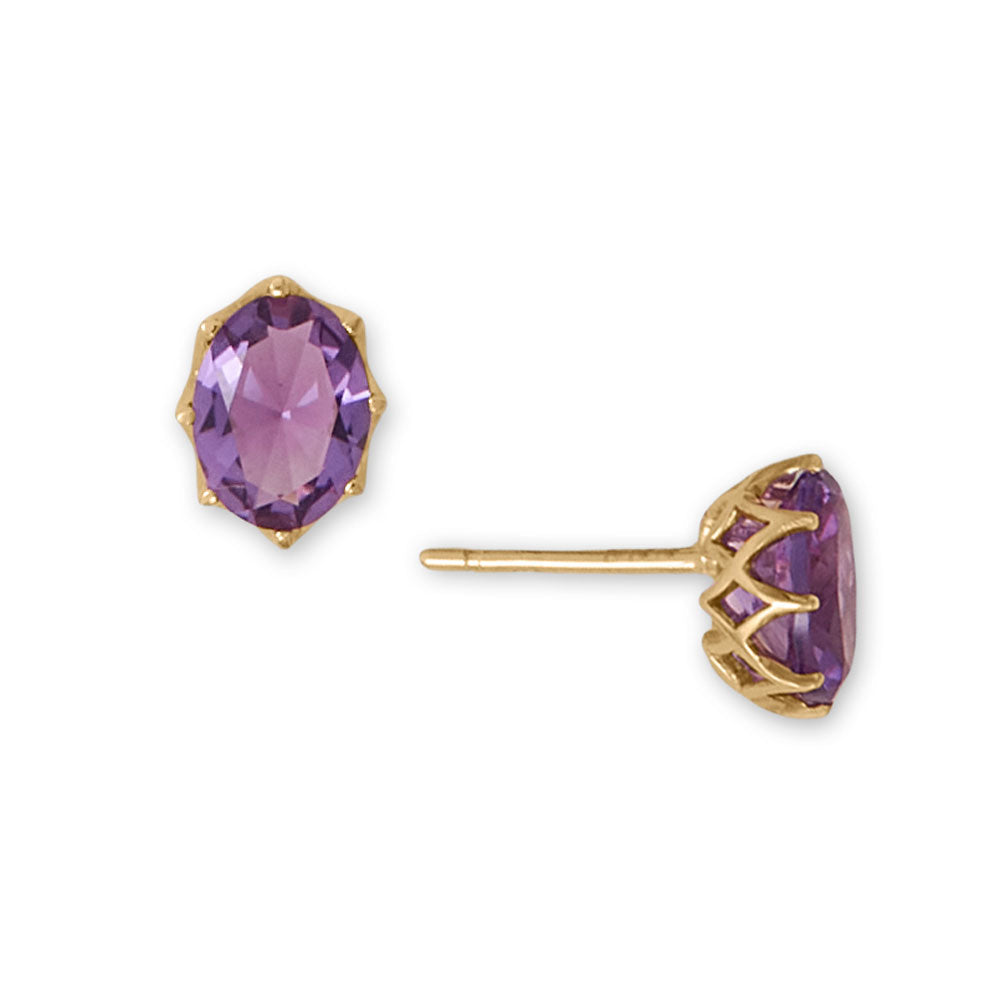 Alluring amethyst earrings! 14kt gold post back earrings feature an 8mm x 6mm precision cut amethyst in openwork detail settings. Earrings are packaged in a gift box. 14kt Gold