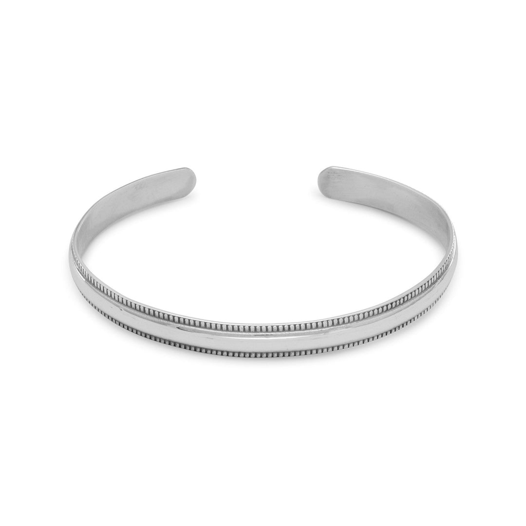Minimalist or fashionista, this cuff is a staple in any wardrobe. Polished sterling silver cuff bracelet with oxidized beaded edge measures approximately 6mm wide.<br>.925 Sterling Silver