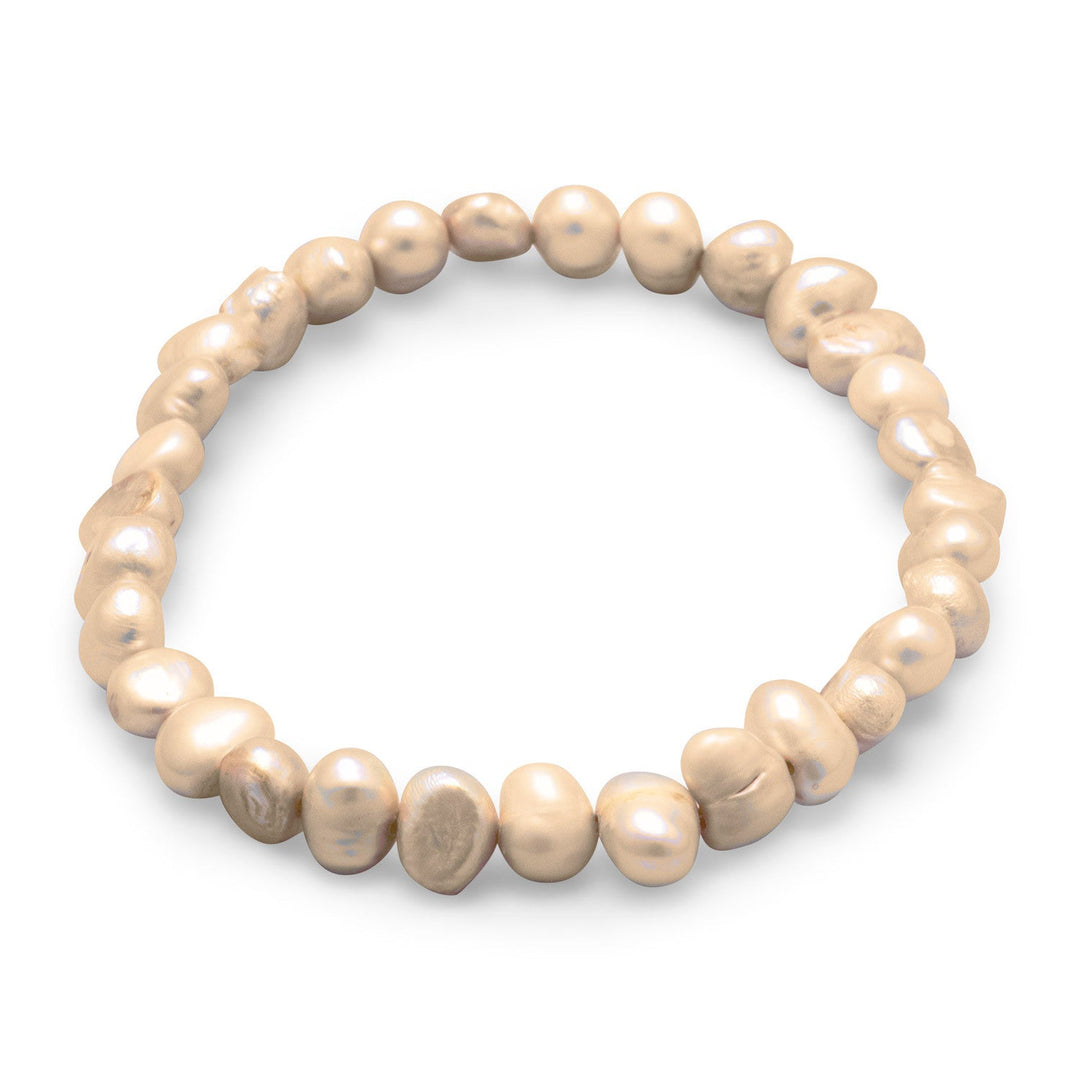 Introducing the Dyed Tan Cultured Freshwater Pearl Stretch Bracelet, a stunning piece of jewelry that exudes elegance and sophistication. This bracelet features cultured freshwater pearls that range in size from 6mm to 8mm, providing a beautiful and varied texture.