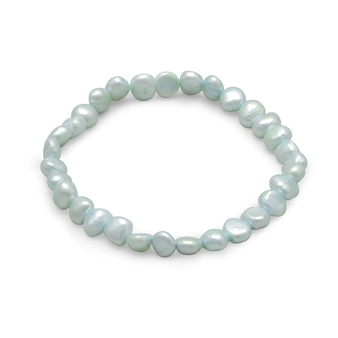 Introducing the Dyed Light Blue Cultured Freshwater Pearl Stretch Bracelet, a stunning piece of jewelry that exudes elegance and sophistication. This bracelet features cultured freshwater pearls that range in size from 6mm to 10mm, providing a beautiful and varied texture.