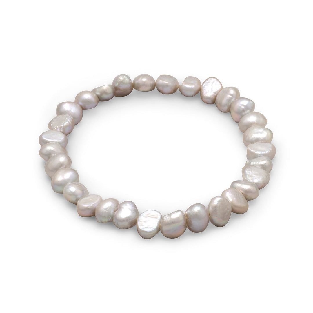 Introducing the Dyed Silver Cultured Freshwater Pearl Stretch Bracelet, a stunning piece of jewelry that exudes elegance and sophistication. This bracelet features cultured freshwater pearls that range in size from 6mm to 7mm, providing a beautiful and varied texture.