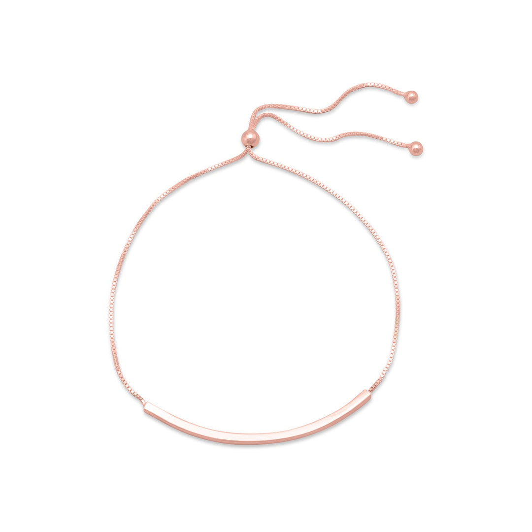 Introducing our exquisite adjustable 14k rose gold plated sterling silver box chain bracelet. Adorned with a polished 2mm x 47mm bar, it exudes elegance. The bracelet adjusts with a 4mm sterling silver bead, ensuring a perfect fit. Crafted with .925 sterling silver, it showcases the beauty of the rose gold plating. With its adjustable length of 9.25", it is a versatile piece that pairs effortlessly with our other rose gold jewelry. A truly luxurious gift for a loved one.