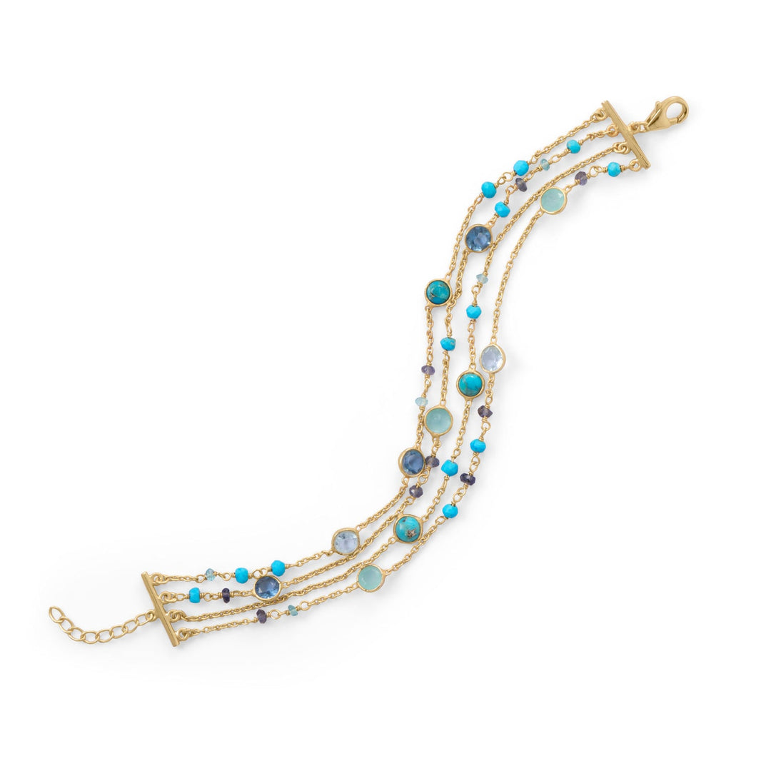 Indulge in the exquisite beauty of our darling bracelet. 14 karat gold plated sterling silver adorned with turquoise, chalcedony, and blue hued gemstones. The pops of colored beads add a touch of luxury. With a lobster clasp closure, this stunning design is a must-have.