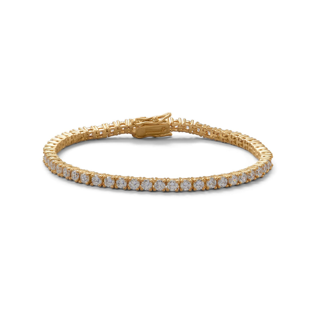 This 7" Tennis Bracelet is designed to add a touch of elegance to your backswing. With a stunning 14K Gold plated finish and a total of 53 gleaming 3mm cubic zirconias, it will surely sparkle on your wrist. The bracelet features a secure box clasp and is made of .925 Silver, ensuring both durability and style.