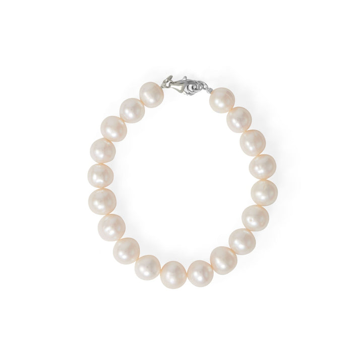A bridal must-have. 8" rhodium plated sterling silver bracelet features 19 9.5mm cultured freshwater potato pearls and a lobster clasp closure.  .925 Sterling Silver