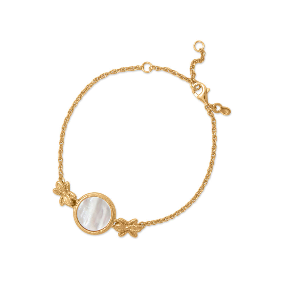 Gold, lovely and luminous! 6" + .75" + .75" 14 karat gold plated sterling silver bracelet features a 12mm mother of pearl with flower design accents. Bracelet is finished with a lobster clasp closure. .925 Sterling Silver
