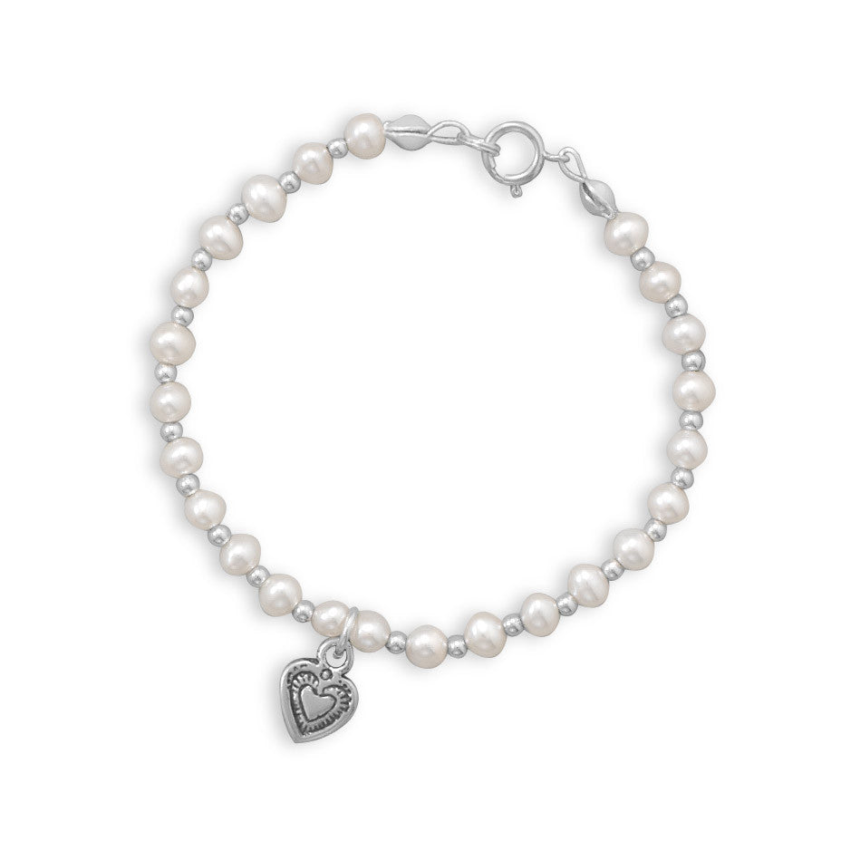 Our exquisite sterling silver bracelet, featuring alternating 4mm cultured fresh water pearls and 2mm silver beads. The bracelet is designed with both sterling silver beads and pearls, creating a harmonious blend of luxury and style. The centerpiece of this bracelet is the oxidized heart drop, adding a touch of romance and charm. Crafted from .925 sterling silver, this bracelet is not only beautiful but also durable and long-lasting.