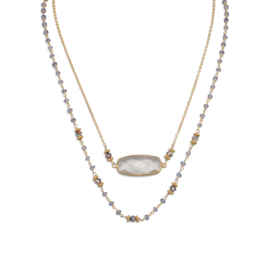 Indulge in the exquisite beauty and value of our double strand vintage style necklace. Featuring a 14K gold plated sterling silver tanzanite bead chain with 4mm bi-cone crystal accents, this piece is a true gem. The second strand boasts a 16mm x 25mm faceted clear quartz on a 14/20 gold fill chain, complete with an ornate square clasp. Made with .925 sterling silver, this necklace is the perfect gift for a loved one. Pair it with our tanzanite beaded bracelet for a truly stunning look.