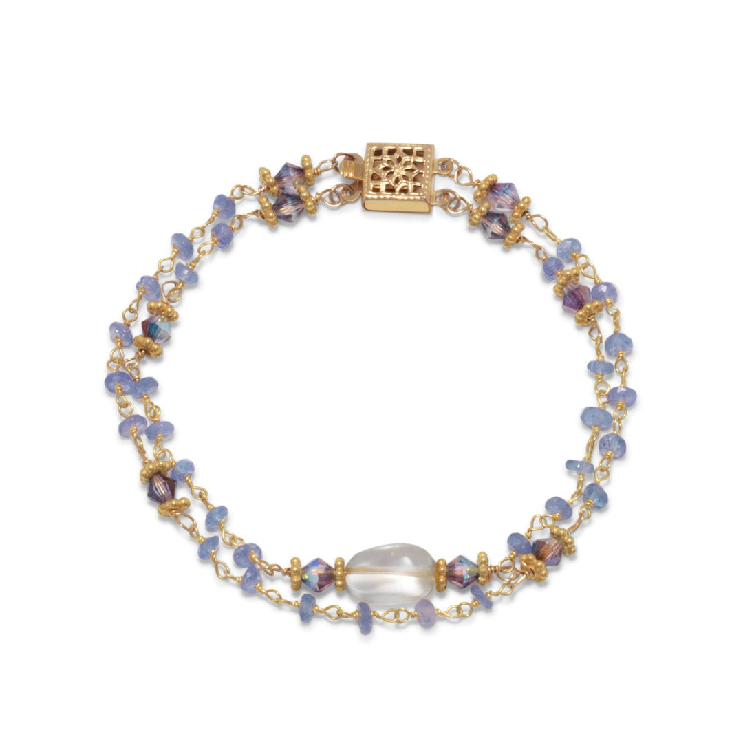 Indulge in opulence with our double strand 14K gold plated sterling silver bracelet, adorned with tanzanite and citrine beads. The ornate 14/20 gold fill clasp and square cubic zirconia add unique style. A fabulous statement piece, perfect for gifting. Pair with our other tanzanite and citrine jewelry for a complete look.