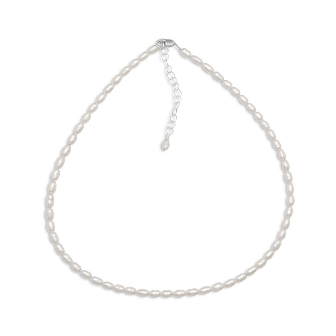 13" + 2" extension sterling silver and cultured freshwater rice pearl necklace with approximately 3.5mm x 5mm white rice pearls. This necklace has a lobster clasp closure. .925 Sterling Silver