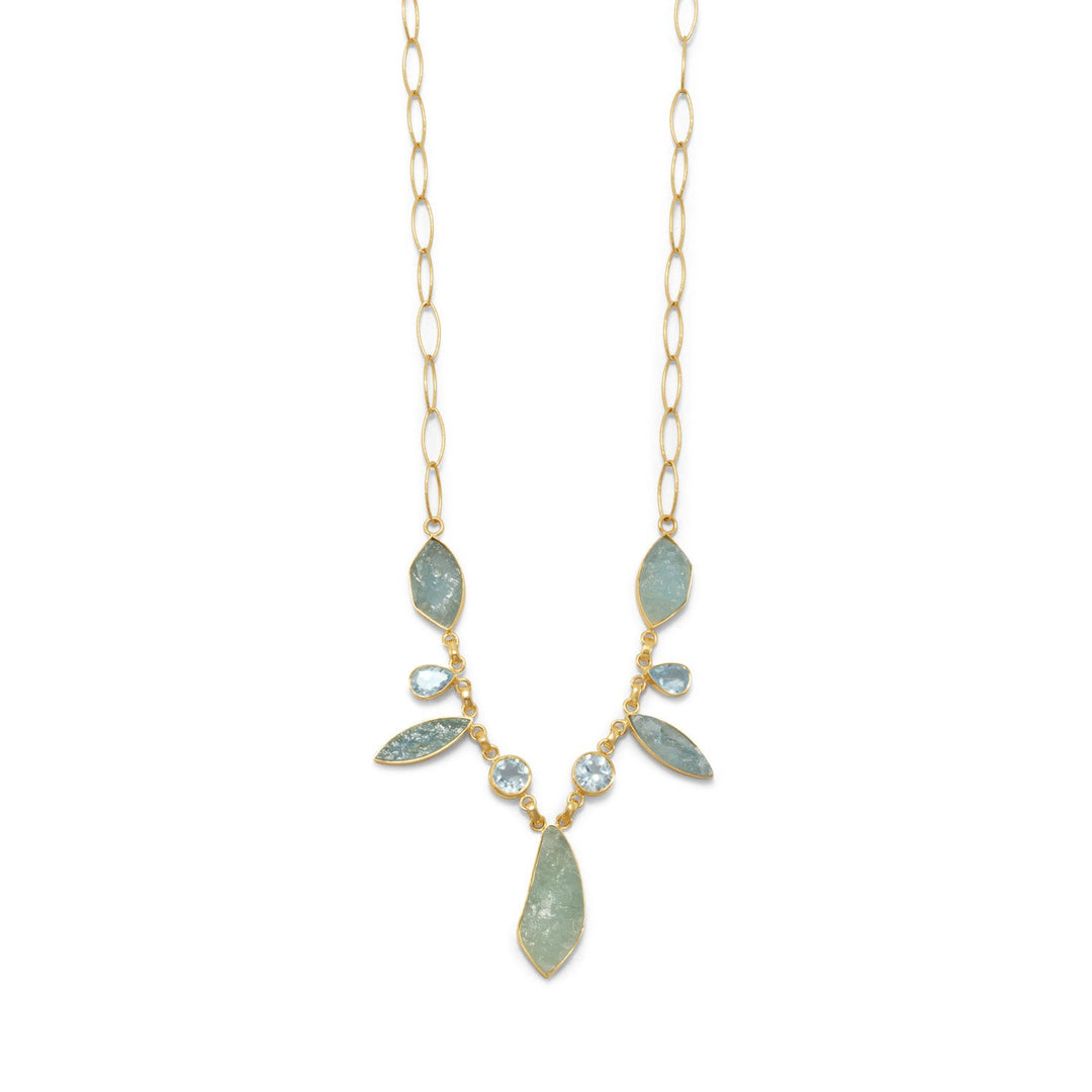 Our gorgeous 14 Karat Gold Aquamarine and Blue Topaz Necklace will turn heads. Statement necklace measures 18" with a 2" extension chain in 14 karat gold plated sterling silver with rough cut aquamarine and faceted blue topaz stones.
