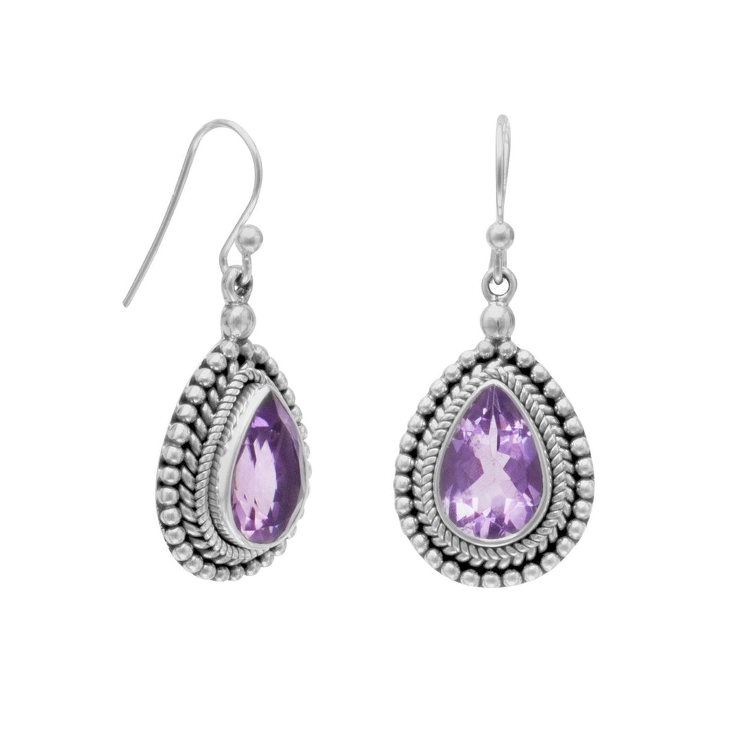 Indulge in the opulence of our exquisite Oxidized Sterling Silver Earrings, featuring a stunning 12mm x 8mm pear-shaped Amethyst. The intricate rope and bead edge design adds a touch of sophistication to these earrings, which hang approximately 38mm. Crafted from .925 Sterling Silver, these earrings pair perfectly with our other Amethyst and Oxidized Sterling Silver jewelry pieces. Elevate your style with this luxurious accessory.