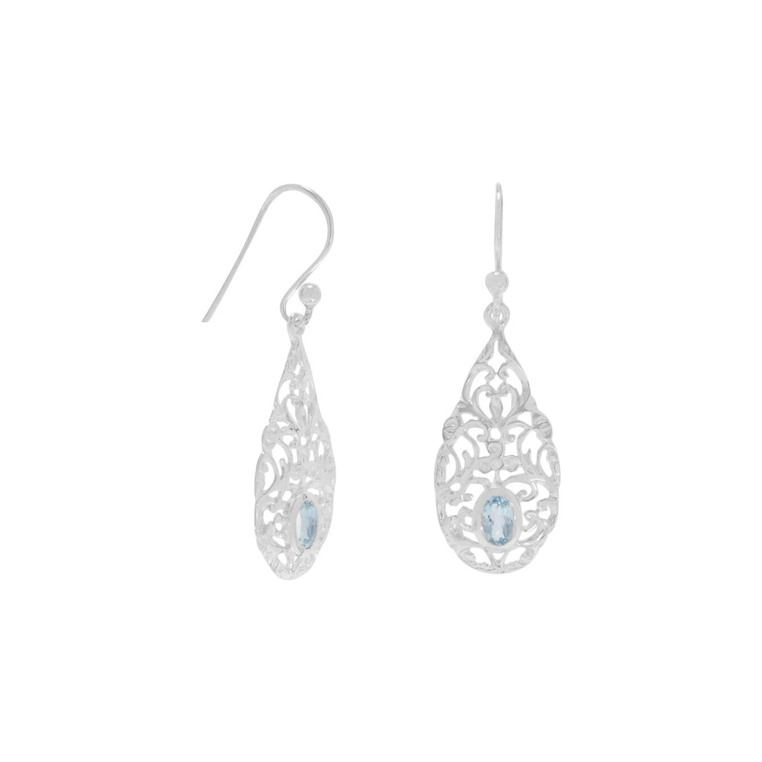 Shiny ornate french wire earrings with oval blue topaz. Blue topaz is 5 x 3.5 mm. The earrings are 37.5 mm in length. .925 Sterling Silver