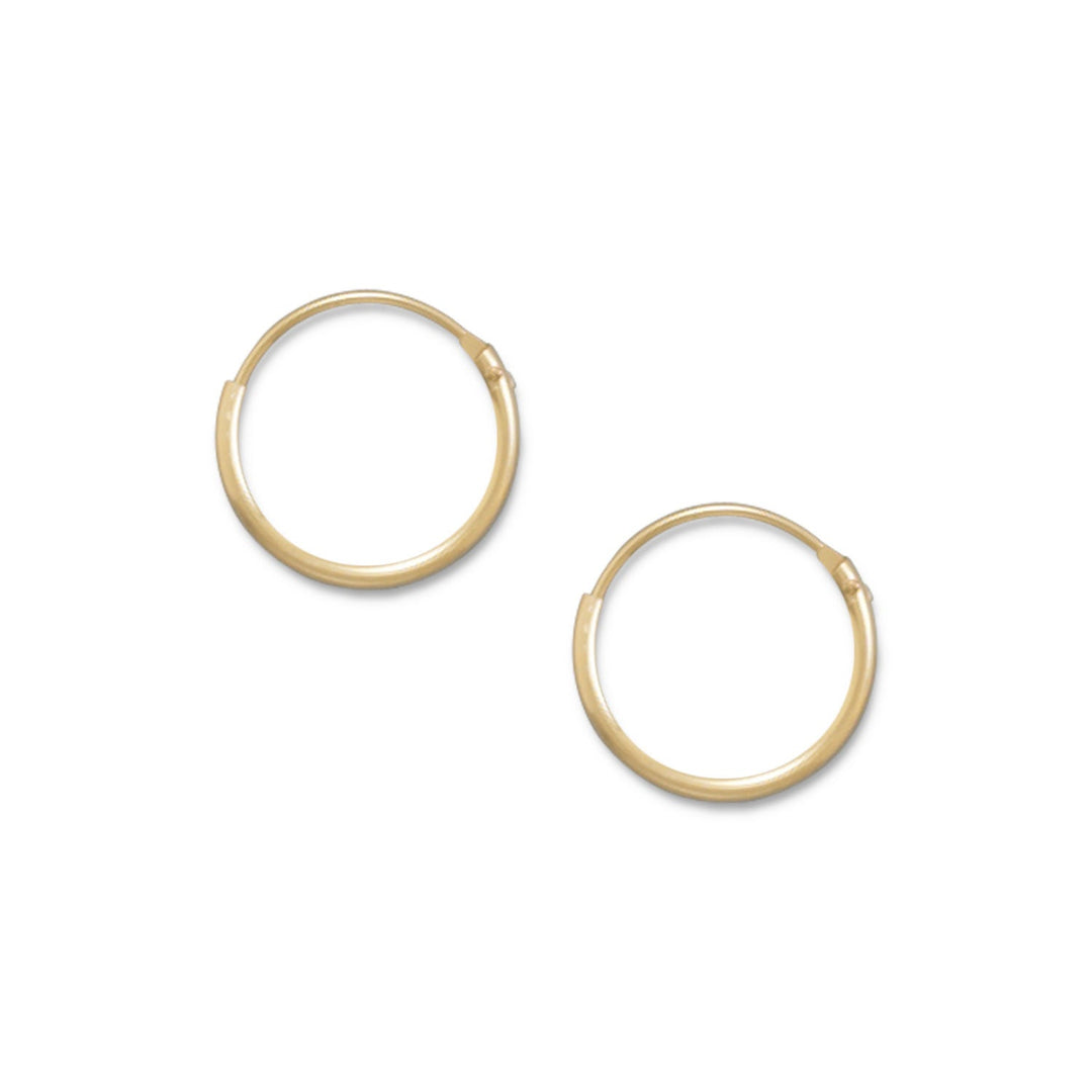 Introducing our classic 14/20 gold filled 1mm x 12mm endless hoop earrings, a stunning addition to any jewelry collection. Crafted with precision and care, these earrings are made with 14 karat gold filling