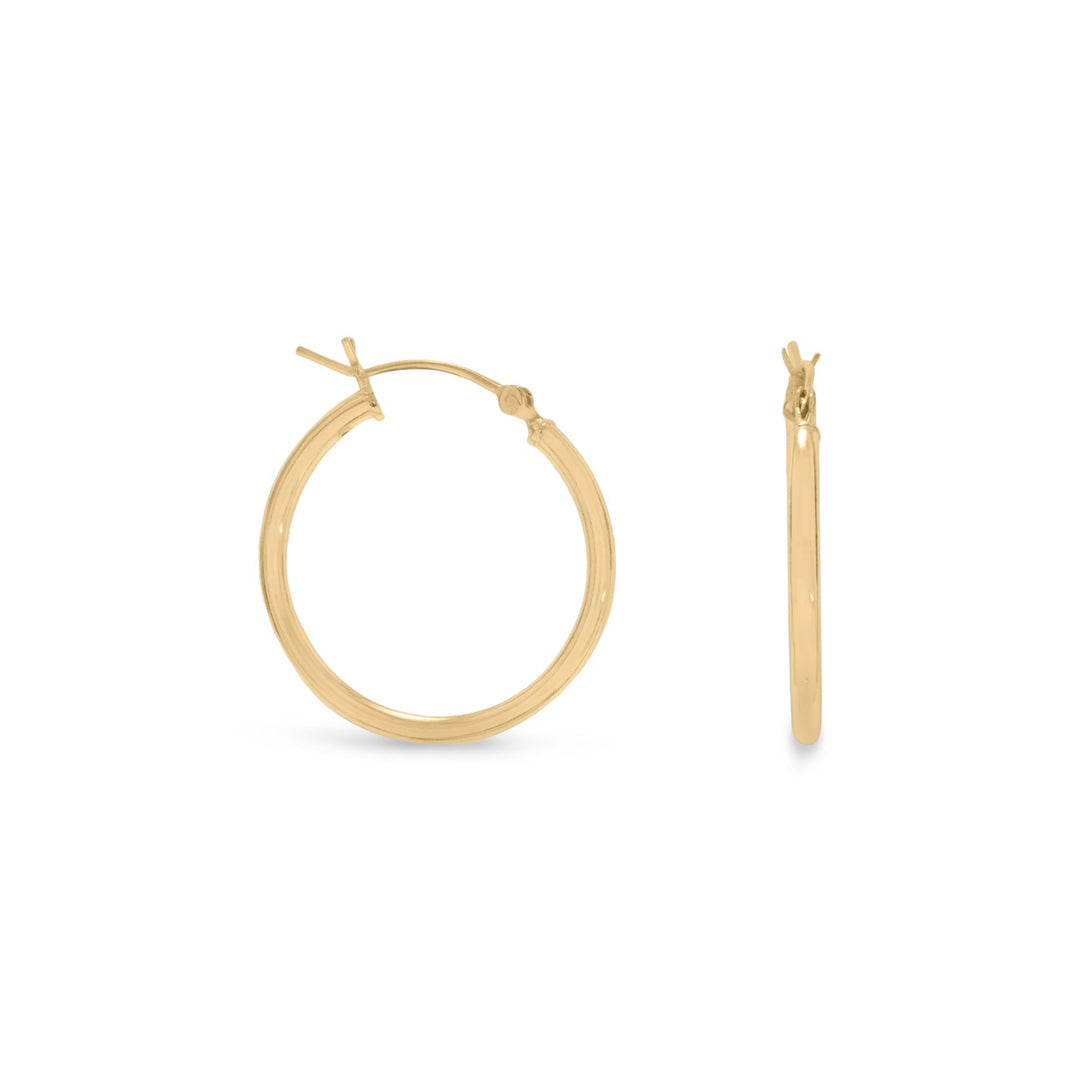 Introducing our exquisite 2mm x 24mm hoop earrings, crafted from premium .925 sterling silver and finished with a luxurious 14 karat gold plating.