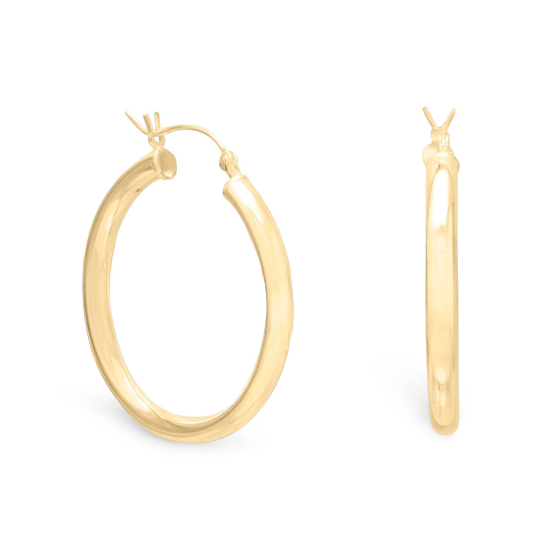 Introducing our exquisite 3mm x 30mm hoop earrings, Crafted from premium .925 sterling silver and finished with a lustrous 14 karat gold plating. These earrings exude a timeless elegance that is sure to captivate any discerning fashion enthusiast. The beauty of the 14 karat gold plating is evident in the way it enhances the natural radiance of the sterling silver, creating a stunning contrast that is both striking and refined.