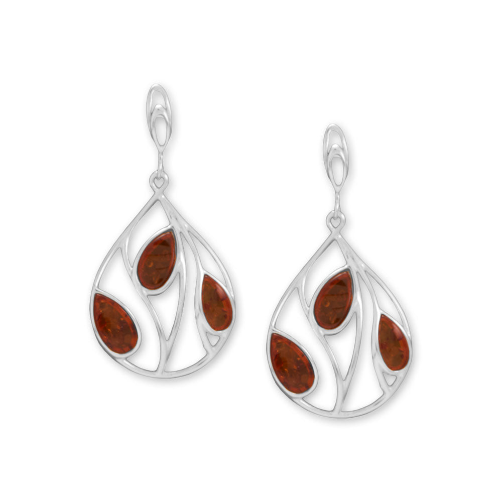 Reminiscent of beautiful fall leaves. Polished sterling silver post earrings have a cutout pear design with three pear-shaped genuine Baltic amber stones. Amber is approximately 9mm x 5mm, 11mm x 6mm, and 10.5mm x 6.5mm. Earrings have a hanging length of 46.8mm. Genuine Baltic amber is from Poland .925 Sterling Silver