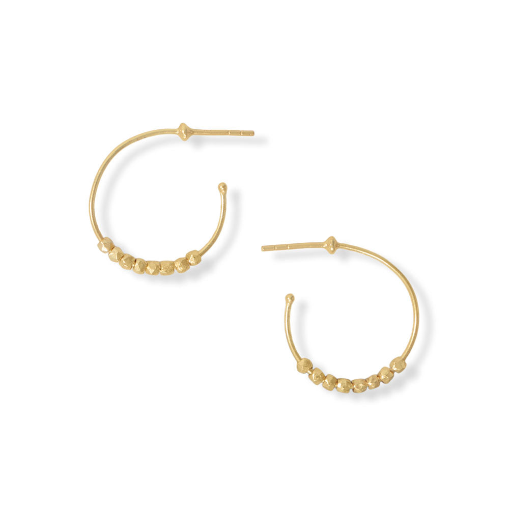 Cute details. 14 karat gold plated sterling silver 3/4 hoop earrings have gold plated floating bead accents. Earrings measure 22.5mm and have a post back.  .925 Sterling Silver 