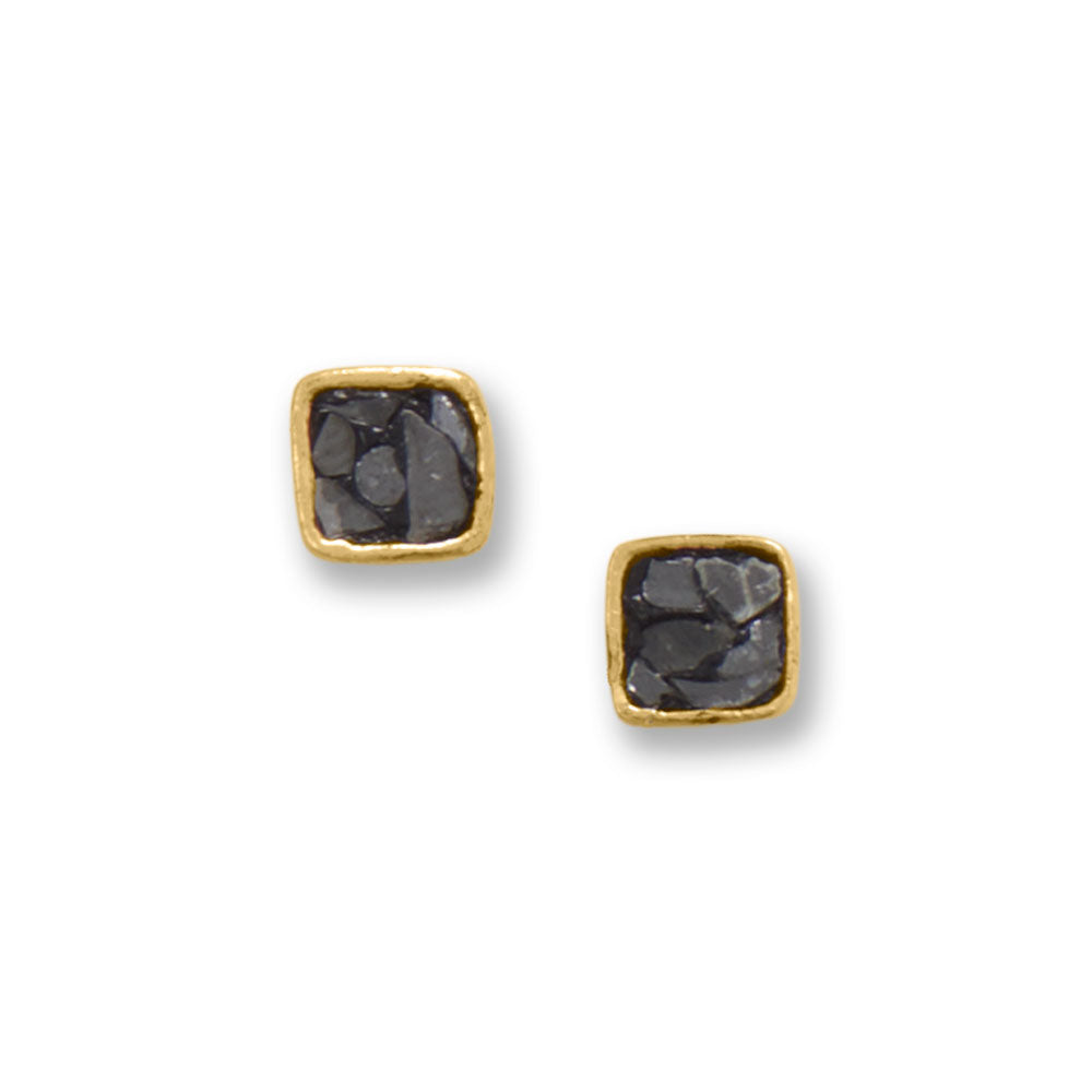 Subtle sparkle. 14 karat gold plated sterling silver stud earrings feature natural diamond chips set in black resin in 5mm x 5mm settings. .925 Sterling Silver
