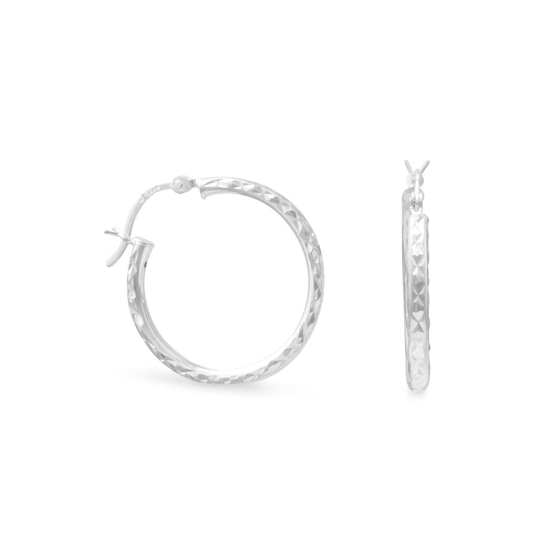 Our exquisite 2.5mm x 25mm diamond cut hoop earrings, crafted with utmost precision from .925 Sterling Silver. These stunning earrings are designed to elevate your style and add a touch of elegance to any outfit. The diamond cut detailing enhances the brilliance of the silver, creating a captivating sparkle that will surely catch everyone's attention.