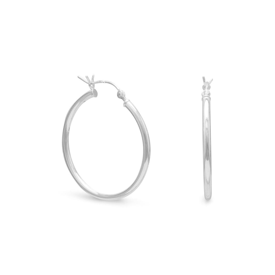 Introducing our exquisite 2mm x 28mm hoop earrings, crafted from premium .925 sterling silver. These earrings are designed to make a bold statement, drawing the attention of onlookers to your face. The 28mm size of the hoop is perfectly proportioned to enhance your features and elevate your style.