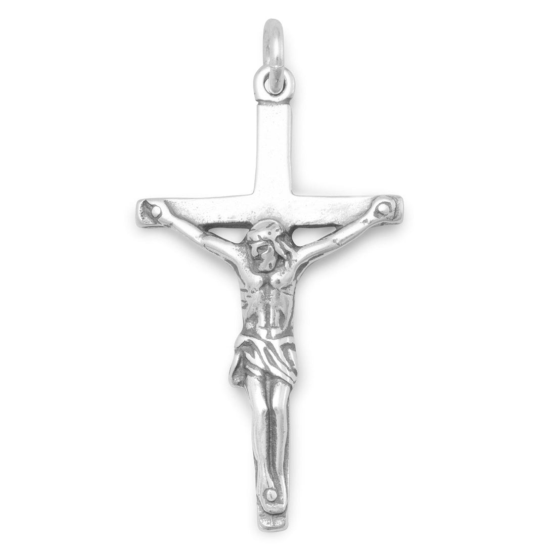 Introducing our exquisite Crucifix, crafted from .925 Sterling Silver and measuring 31mm x 17.5mm. This stunning piece holds great spiritual significance, symbolizing the ultimate sacrifice and protection over the wearer. Its timeless design pairs seamlessly with any of our beautiful sterling silver necklace chains, making it a versatile addition to any jewelry collection. Suitable for both men and women, this Crucifix serves as a statement piece, exuding elegance and sophistication.