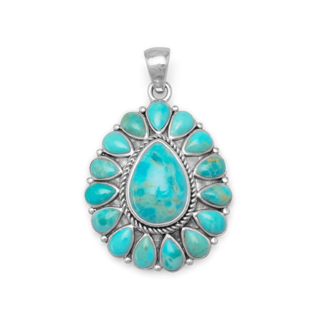 Oxidized sterling silver pear shape reconstituted turquoise pendant. The center turquoise stone is approximately 9mm x 13mm, with 3mm x 5mm turquoise stones all around. The pendant is approximately 23mm x 37mm. .925 Sterling Silver