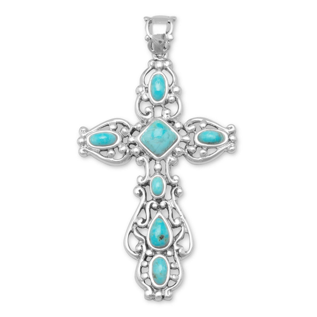 Our exquisite Oxidized Sterling Silver Ornate Scroll Design Cross with Reconstituted Turquoise. Crafted with utmost precision and attention to detail, this luxurious pendant showcases a stunning center turquoise piece measuring approximately 6mm. The cross itself boasts an impressive size of approximately 26mm x 50mm, making it a true statement piece. Made from .925 sterling silver, this masterpiece exudes elegance and sophistication.