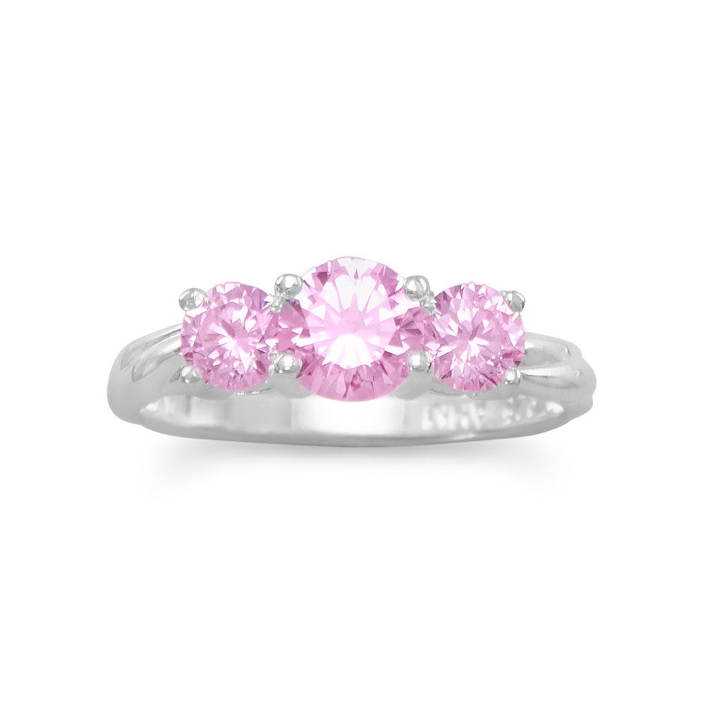 Introducing our exquisite 'Pretty 'n Pink' ring, crafted from .925 Sterling Silver. Adorned with a captivating 6mm round pink cubic zirconia, complemented by 4.5mm round pink cubic zirconias on each side. A mesmerizing combination of elegance and opulence that will undoubtedly captivate all onlookers. Available in whole sizes 4-10, this luxurious piece is a testament to the timeless allure of pink cubic zirconias against the backdrop of sterling silver.