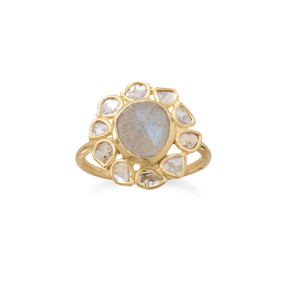 We just love the polki diamonds, presented in a darling flower design! 14 karat gold plated sterling silver with an 8mm x 9mm freeform labradorite at center and freeform polki diamond halo. Polki diamonds are natural, uncut diamond slices. Ring measures 16.5mm x 17.2mm on 1.6mm band. Available in whole sizes 6-9. .925 Sterling Silver