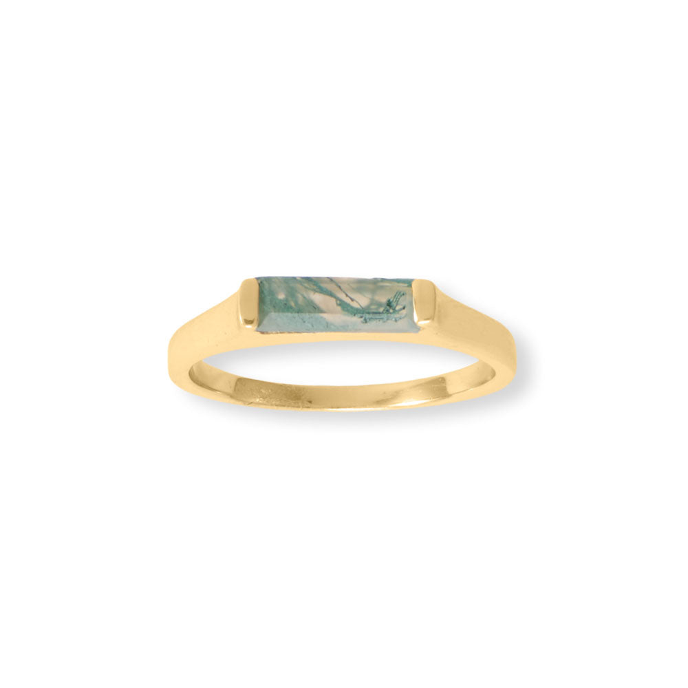Indulge in the exquisite balance and stability of this one-of-a-kind gemstone. The 14 karat gold plated sterling silver bar ring boasts a 10mm x 3mm baguette cut moss agate stone, each with a unique variegated appearance. Available in whole sizes 6-9, this .925 sterling silver piece pairs flawlessly with our other moss agate and gold jewelry collection.