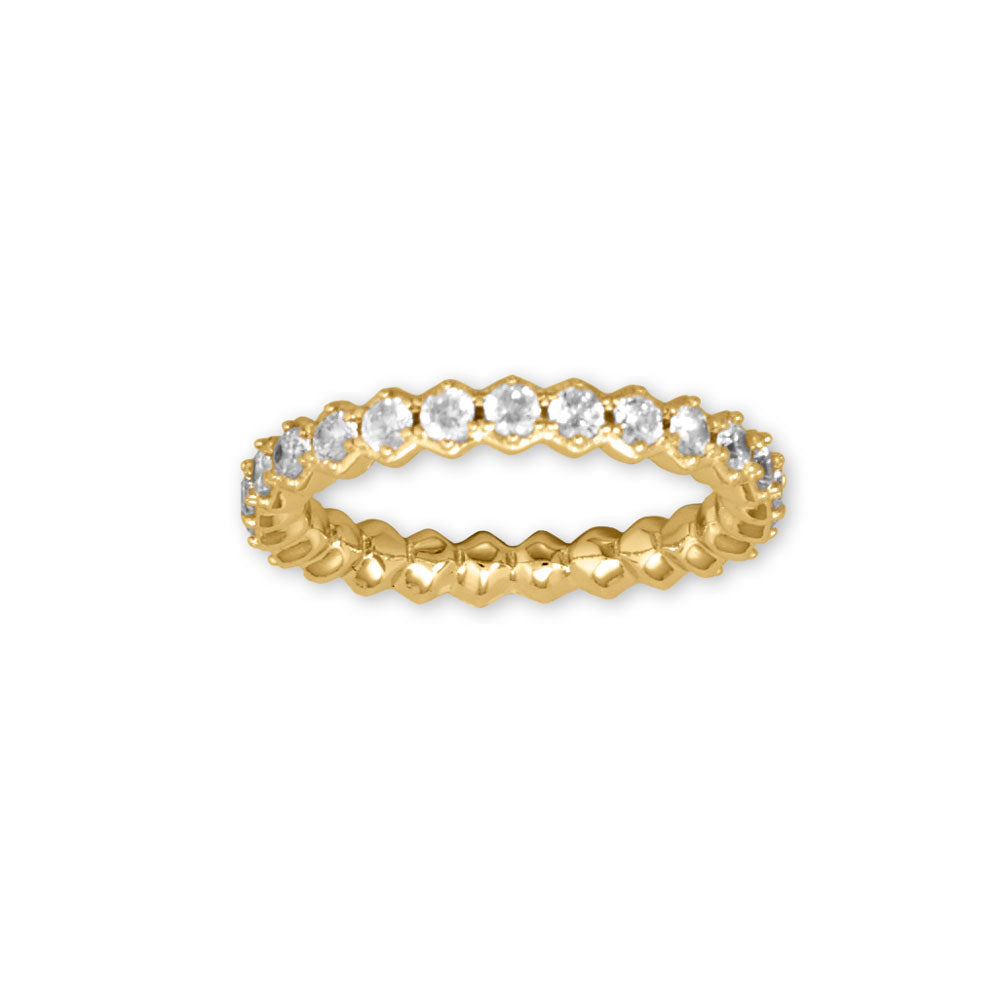 Introducing our stunning 14 karat gold plated eternity ring, designed with hexagonal shape settings and adorned with 2.5mm round cubic zirconia. The band is 3.6mm wide and available in whole sizes 6-9. Made with .925 sterling silver, this ring pairs perfectly with our gold and cubic zirconia jewelry collection. Elevate your style with this timeless piece.