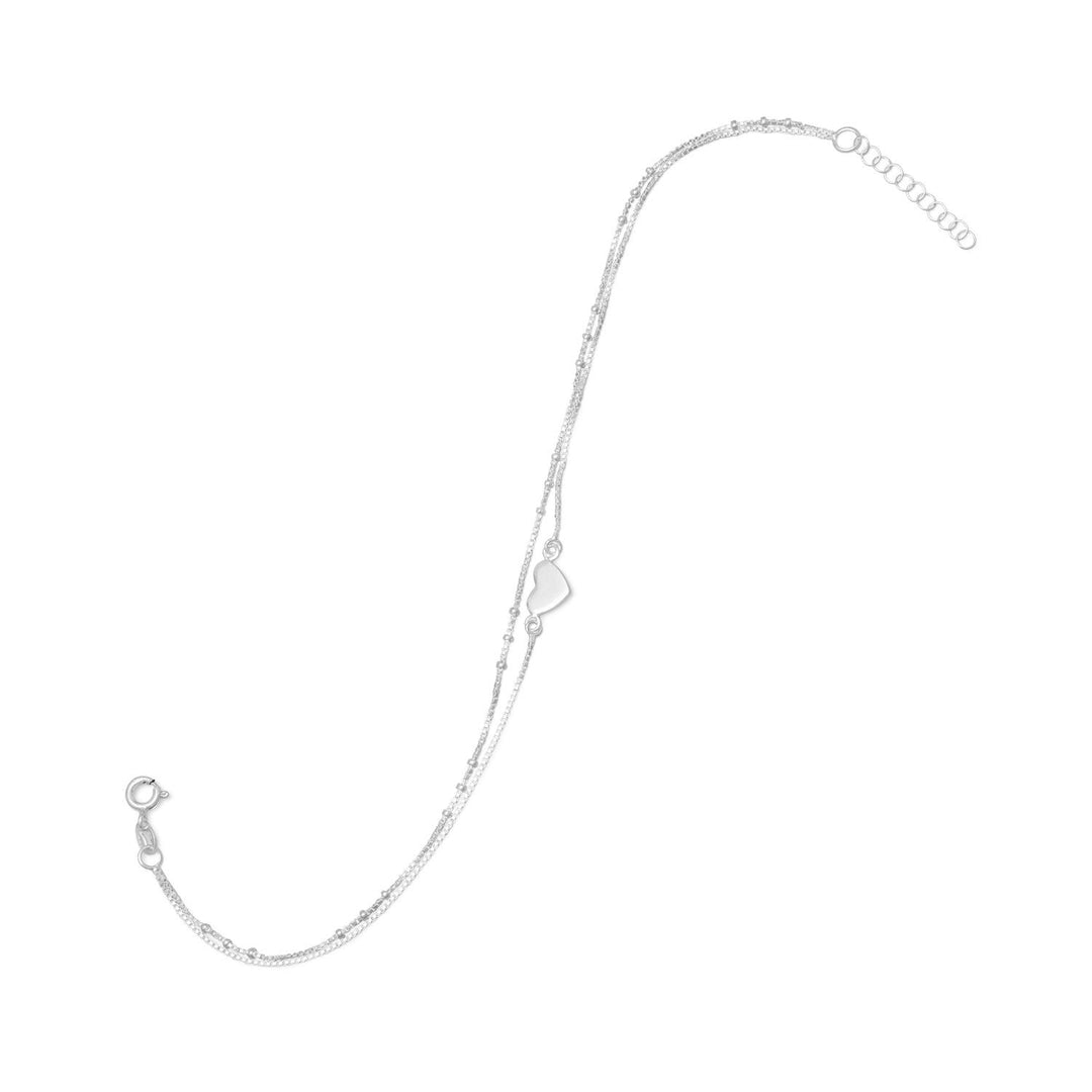 Introducing the 11" + 1" extension double strand sterling silver box chain anklet, a stunning piece of jewelry that exudes elegance and sophistication. This anklet features two strands, one with a delicate bead design and the other with a polished 8mm x 9mm heart, adding a touch of charm and grace to any outfit. Crafted from .925 sterling silver, this anklet is not only beautiful but also durable and long-lasting.