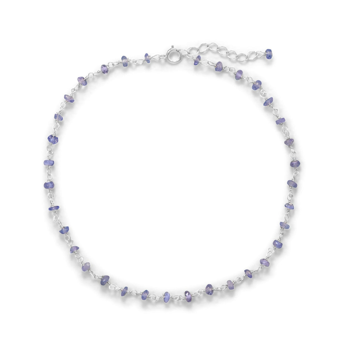 Elevate your style effortlessly with our exquisite anklet. Crafted from luxurious .925 sterling silver, adorned with tanzanite rondell beads, it exudes sophistication. Its adjustable fit and healing properties make it a must-have for everyday wear.