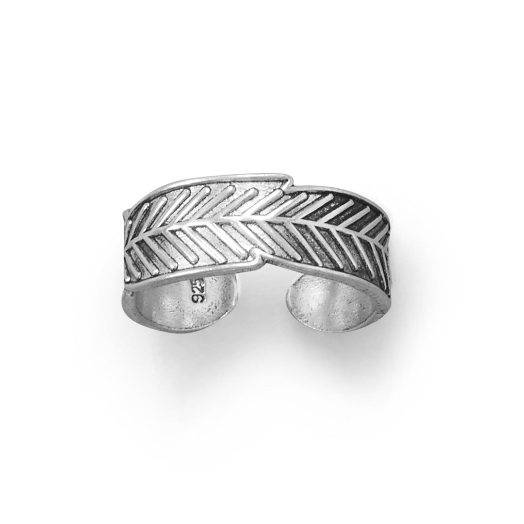 Crafted from .925 sterling silver, this toe ring boasts exceptional quality and durability. Featuring an adjustable design, this toe ring is perfect for all foot sizes, providing a comfortable and secure fit. The band measures approximately 6.3mm wide, making it a statement piece that is sure to catch the eye. The oxidized finish of this sterling silver toe ring adds a touch of vintage charm.