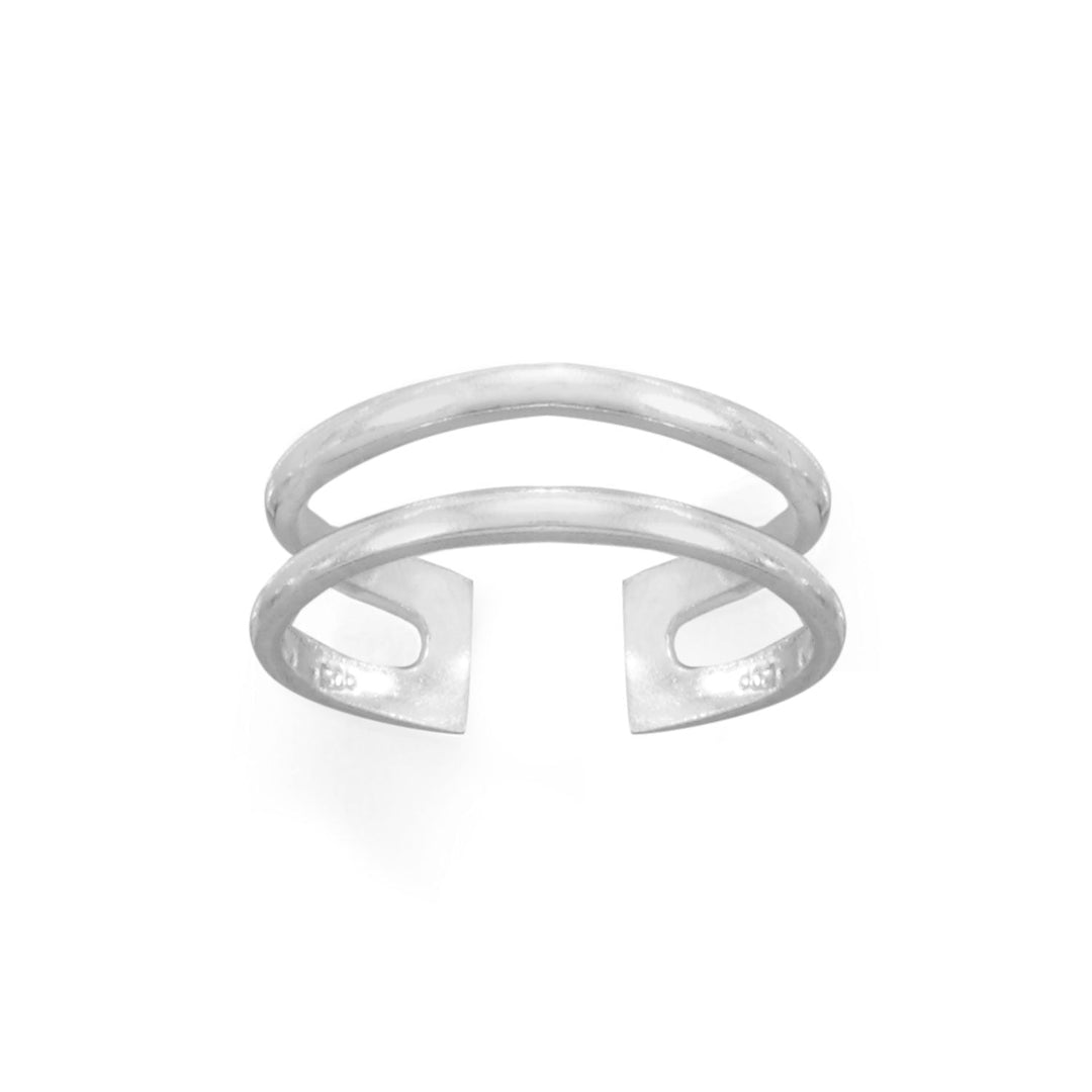 Introducing our Adjustable Sterling Silver Double Row Toe Ring, a stunning addition to your jewelry collection. Crafted from .925 sterling silver, this toe ring boasts a sleek and polished accent for your feet. Measuring approximately 5.5mm wide, the individual bands are approximately 1.5mm wide and designed to look like two rings, connected in the back. This toe ring is lightweight and easily adjustable, ensuring a comfortable fit for any foot size.