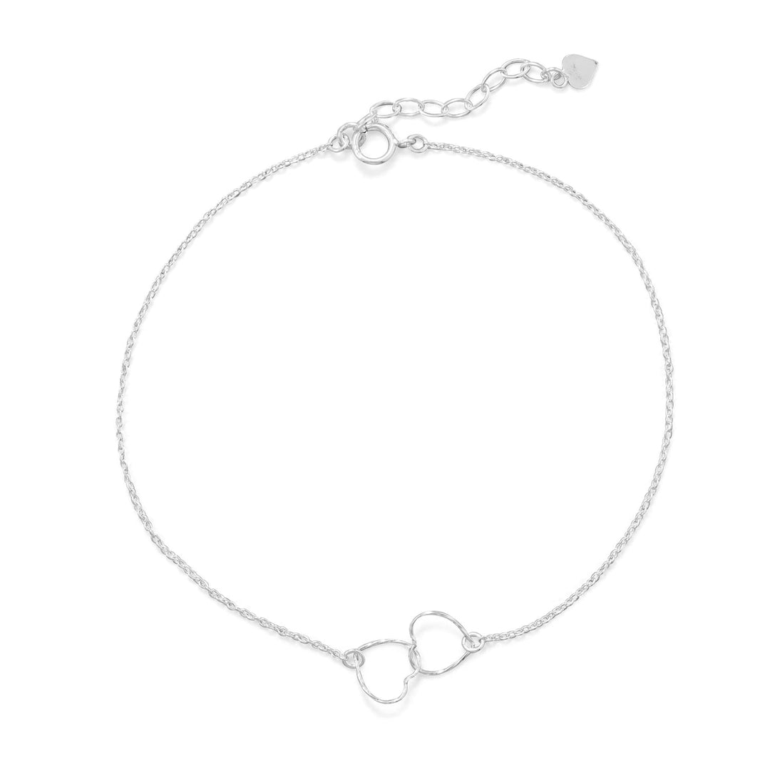 Introducing the exquisite 9"+1" sterling silver anklet, a true embodiment of love and elegance. This anklet boasts two interlocking twisted wire hearts, each measuring 8.7mm x 8.9mm, symbolizing the unbreakable bond of love. The intertwined hearts hold a deep meaning, making this anklet a thoughtful gift for a loved one or a cherished addition to your own jewelry collection.