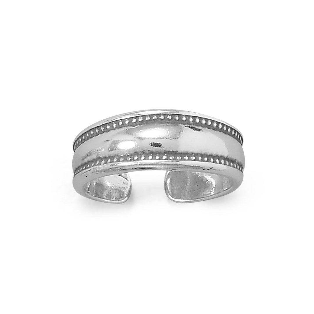 Step up your style game with the Oxidized Sterling Silver Dotted Edge Design Toe Ring. Crafted from .925 sterling silver, this stunning piece of jewelry boasts a beautiful celtic design that adds a touch of sophistication to any outfit. Measuring approximately 15.8 mm x 5.8 mm, this toe ring is the perfect size to fit comfortably on your toe. The open design allows for adjustability, ensuring a snug and secure fit.