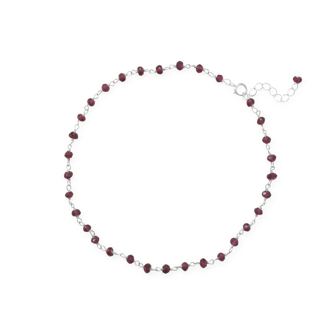 Grab your jewels and hit the beach! 9.5" sterling silver anklet with 1" extension features 2.5mm x 3.5mm garnet beads. .925 Sterling Silver