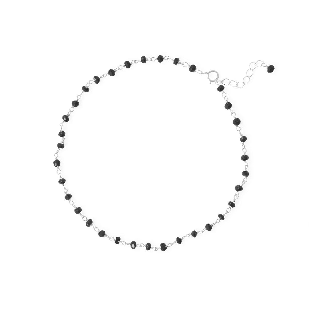 Dance in the moonlight, strut your stuff and wear with any and all outfits! 9.5" sterling silver anklet with 1" extension chain features 2.5mm black spinel beads. .925 Sterling Silver