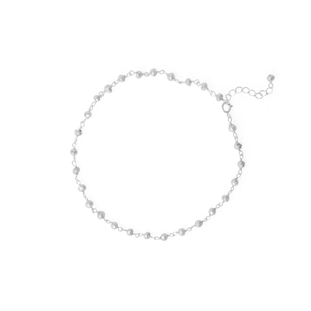 Get ready to dazzle with this stunning anklet! Crafted from .925 sterling silver, this 9.5" beauty boasts 3.3mm silver pyrite beads that shimmer and shine like the sun. With a 1" extension, it's the perfect fit for any ankle. Add some sparkle to your step and shine on!