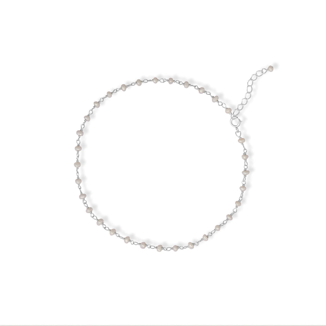 Introducing our Pearl and Summer Anklet, a timeless combination that exudes elegance! Crafted with .925 Sterling Silver, this 9.5" anklet boasts delicate 2.3mm x 1.5mm pearl beads, adding a touch of sophistication to any outfit. With a convenient 1" extension and a secure spring ring closure, it's a must-have accessory for the season!
