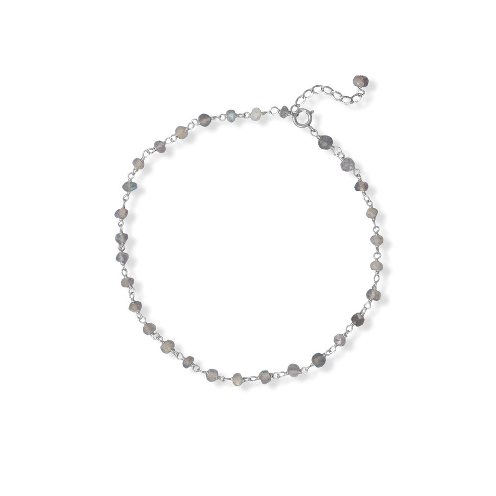 Elevate any outfit with our exquisite light rope chain. Crafted from high-quality .925 sterling silver, this delicate yet durable chain features mesmerizing labradorite beads known for their healing properties. Measuring 9.5" with a 1" extension and a secure spring ring closure, it's perfect for any occasion. Individually carded packaging adds an extra touch of elegance, making it the perfect gift for yourself or a loved one. Invest in timeless elegance with our light rope chain.