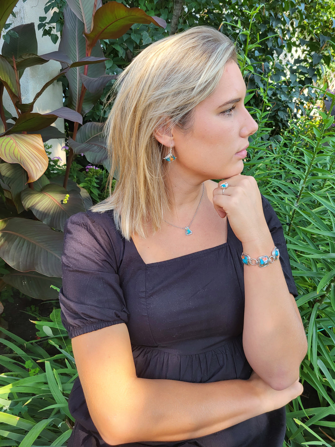 Young woman wearing the Spiny Oyster and Turquiose Jewelry Collection.