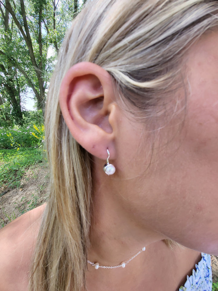 Introducing our Classic Style Lever Earrings! Simplicity at its best with a 6.5mm cultured freshwater pearl. Safety and elegance combined. Made with .925 Sterling Silver. Complete your ensemble with our stunning collection. A must-have for the discerning connoisseur.