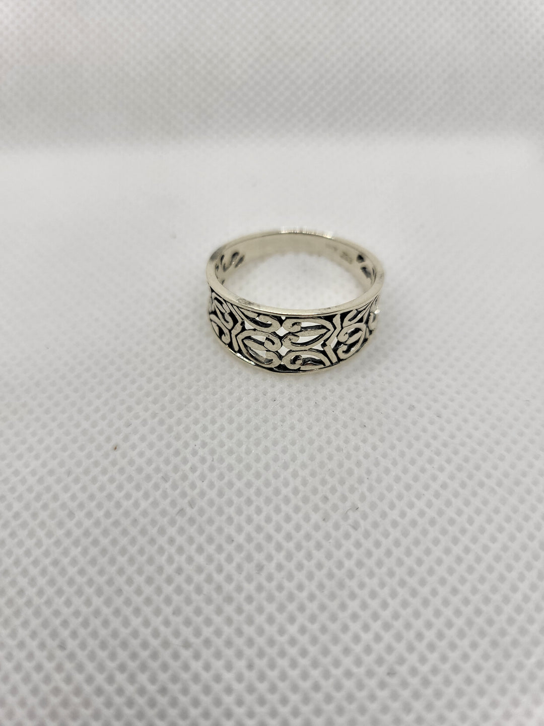 Experience the epitome of luxury with our stunning oxidized sterling silver cut out heart design ring. Meticulously crafted with Celtic-inspired heart cut outs and a tapered band, this piece exudes elegance. Available in sizes 5-9, it pairs perfectly with our other oxidized sterling jewelry collection pieces. Made with .925 sterling silver, this ring is a must-have addition to any discerning jewelry collection.