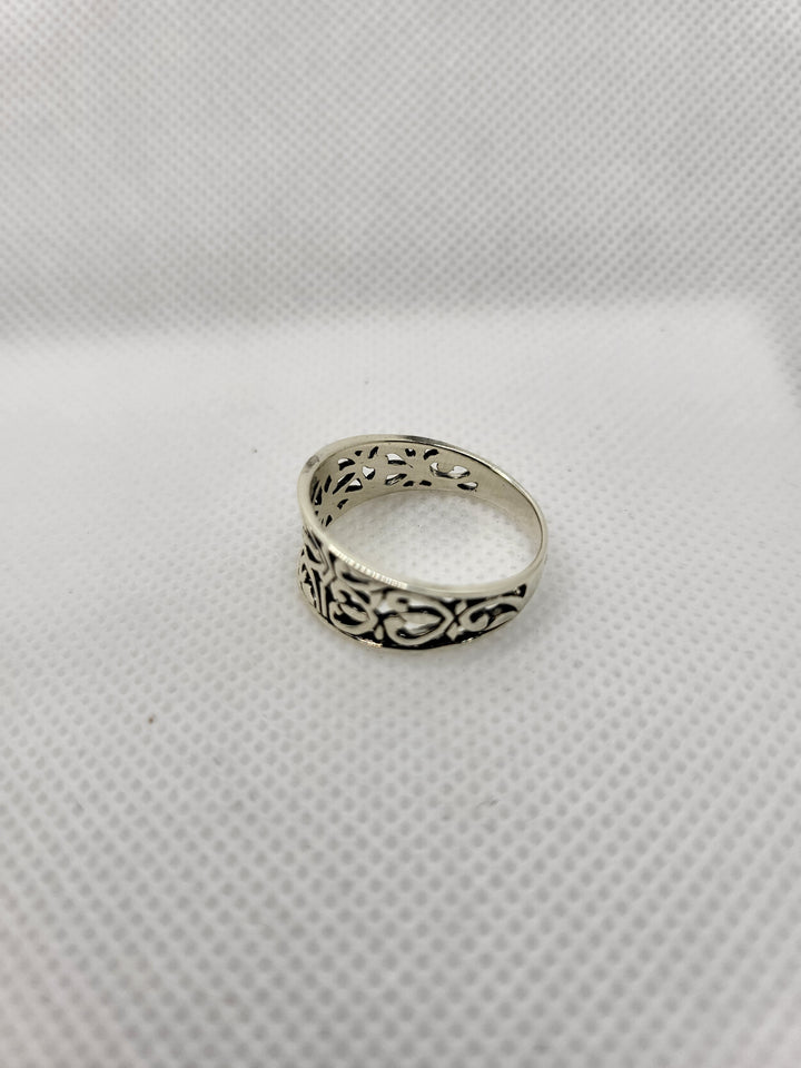 Indulge in the exquisite beauty of our Oxidized Sterling Silver Cut Out Heart Design Ring, a true masterpiece of craftsmanship. The intricate heart cut out designs, inspired by the Celtic style, are meticulously crafted in oxidized sterling silver, creating a stunning contrast that is both elegant and edgy.