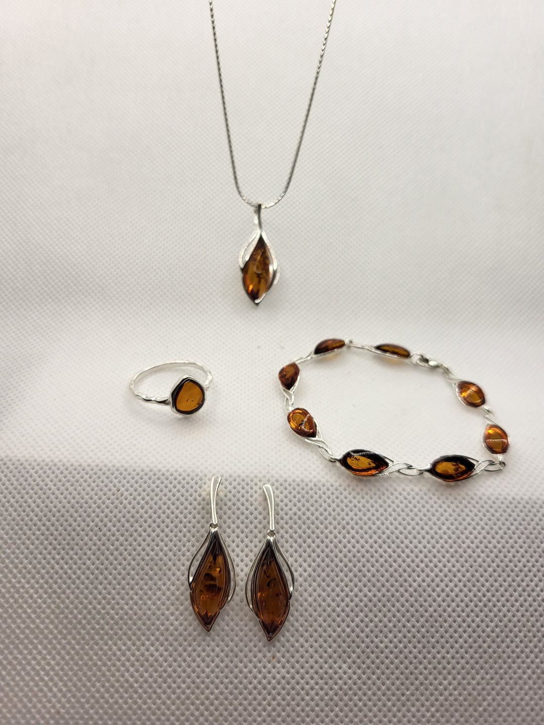 To truly embrace the essence of luxury, we invite you to complete your ensemble by pairing these earrings with our other sterling silver and Baltic Amber jewelry pieces. Each meticulously crafted item in our collection is a testament to our commitment to excellence, ensuring a cohesive and harmonious look that will leave a lasting impression.