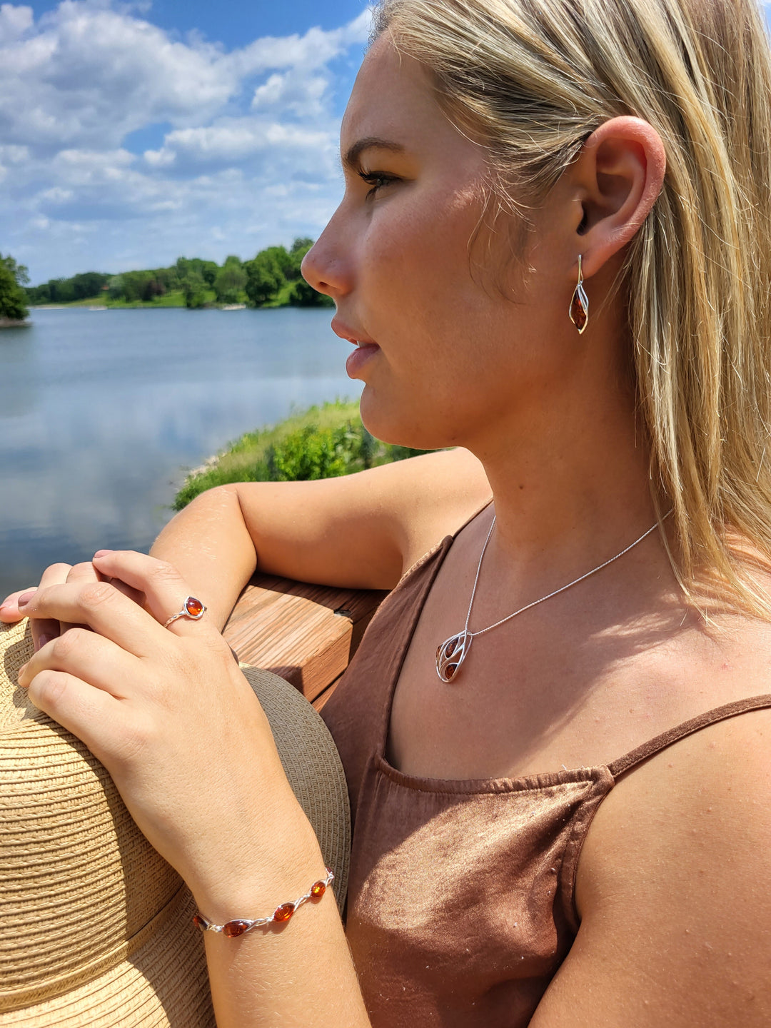 Introducing our stunning 7" sterling silver cutout bracelet, adorned with genuine Baltic amber. Its classic, polished look exudes beauty and value. Complete with a secure lobster clasp closure, this piece pairs perfectly with our other Baltic amber jewelry. Get ready to turn heads!